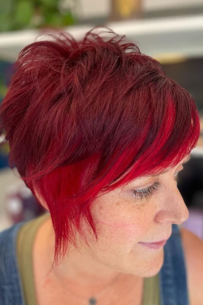 Autumnal Red Pixie with Layered Texture and Side-Swept Bangs