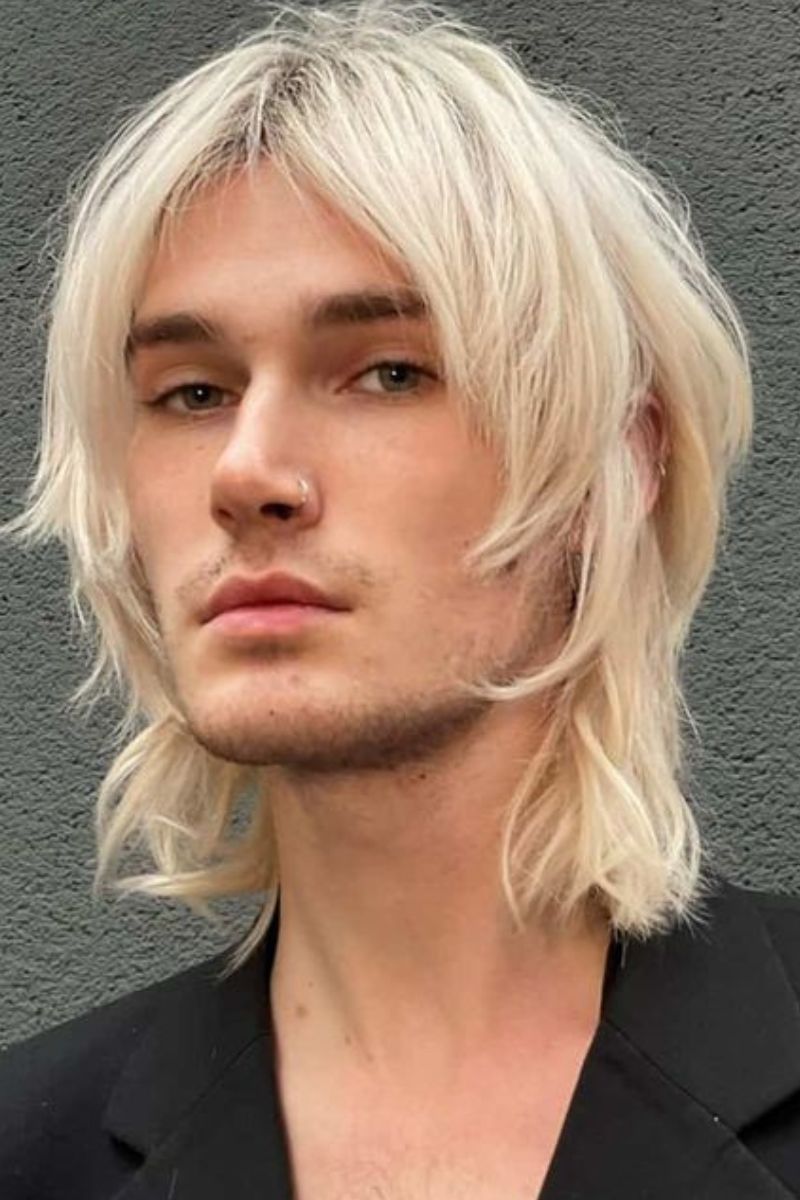 Blonde, Medium-Length Wolf Cut with Curtain Bangs.