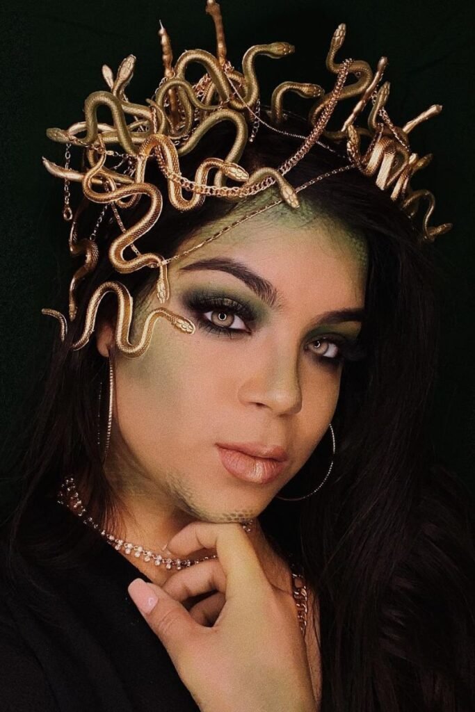 Medusa hairstyle with golden snake crown and smooth dark waves