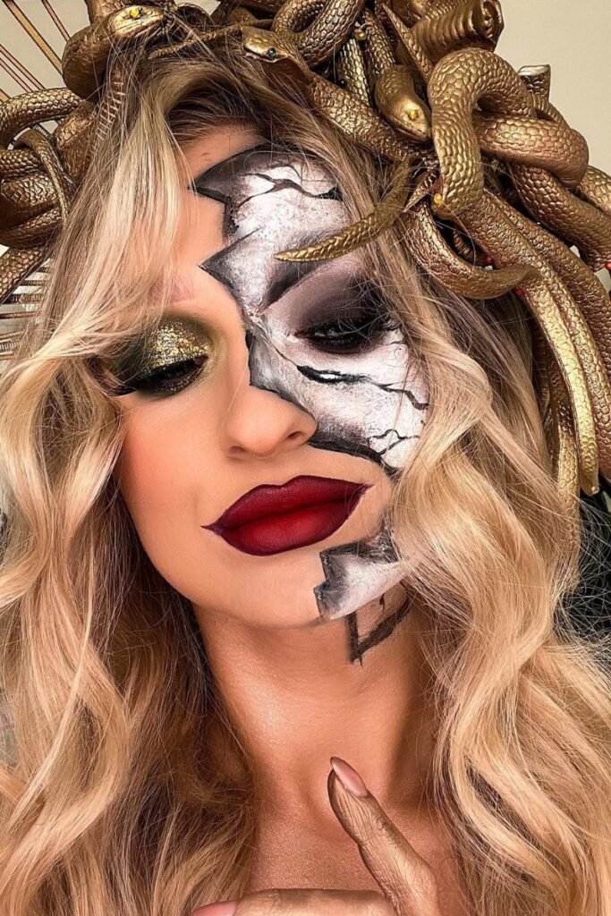 Medusa-inspired hairstyle with blonde waves golden snake crown and dramatic makeup