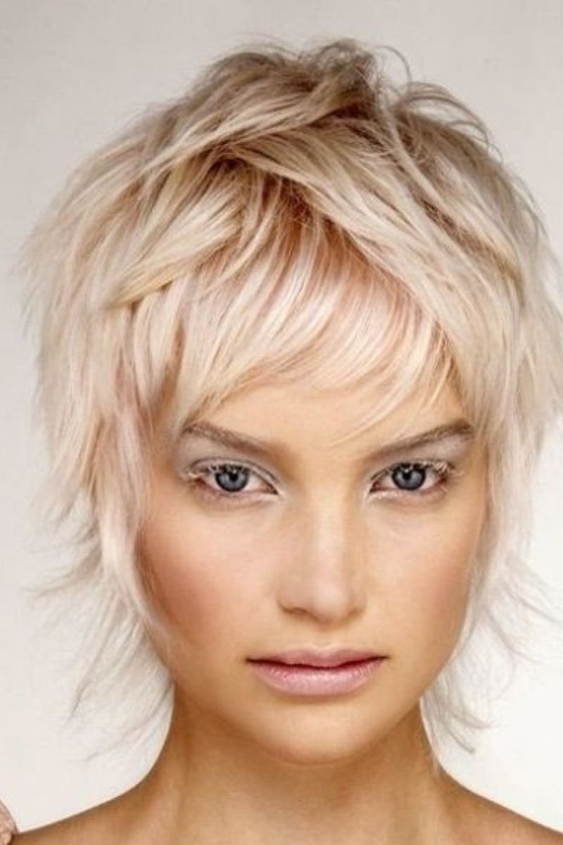 Short Wavy Light Blonde Shag Hairstyle with Layered Bangs