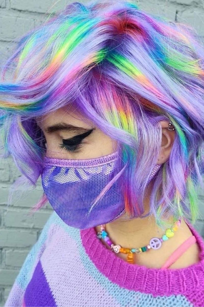 Short wavy pastel rainbow bob with vibrant streaks