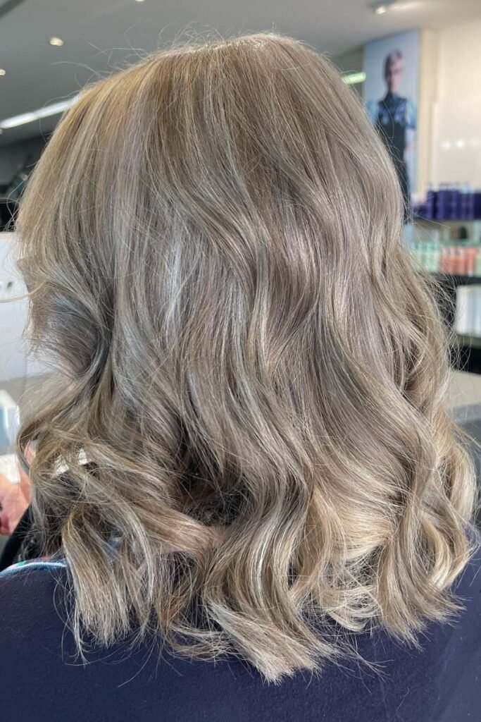 Smoky Ash Blonde with Soft Waves and Natural Finish