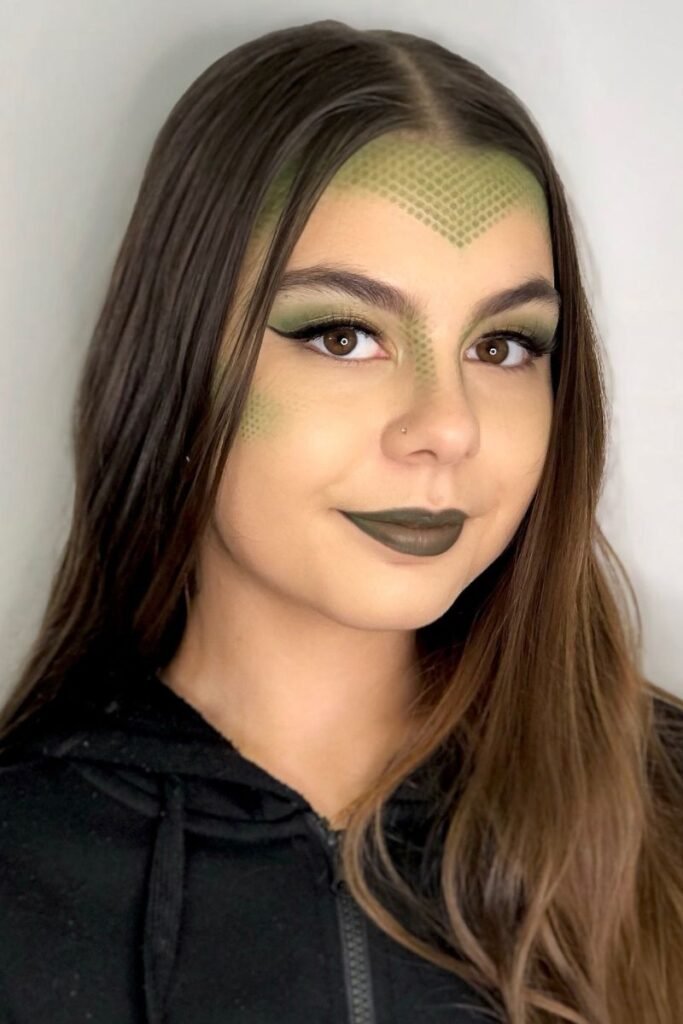 Straight sleek hair with Medusa-themed makeup and scales