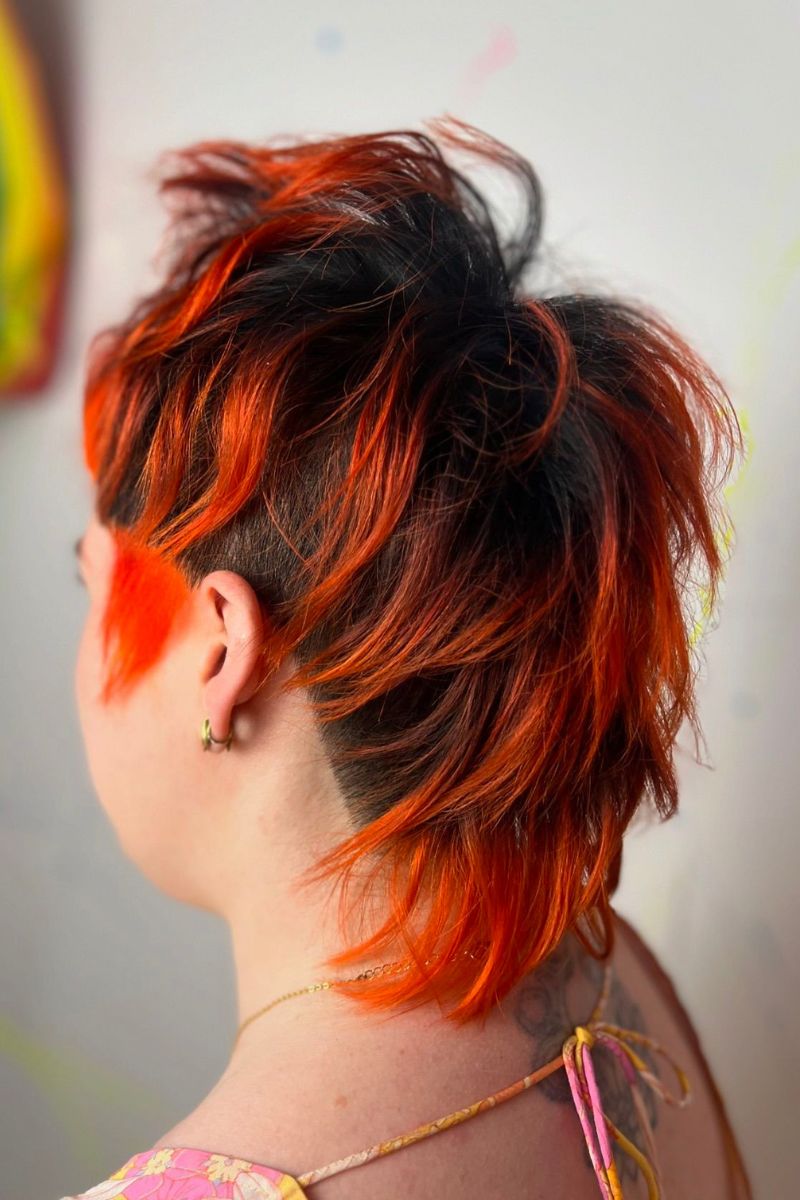 Textured mullet with fiery orange highlights and dark undercut