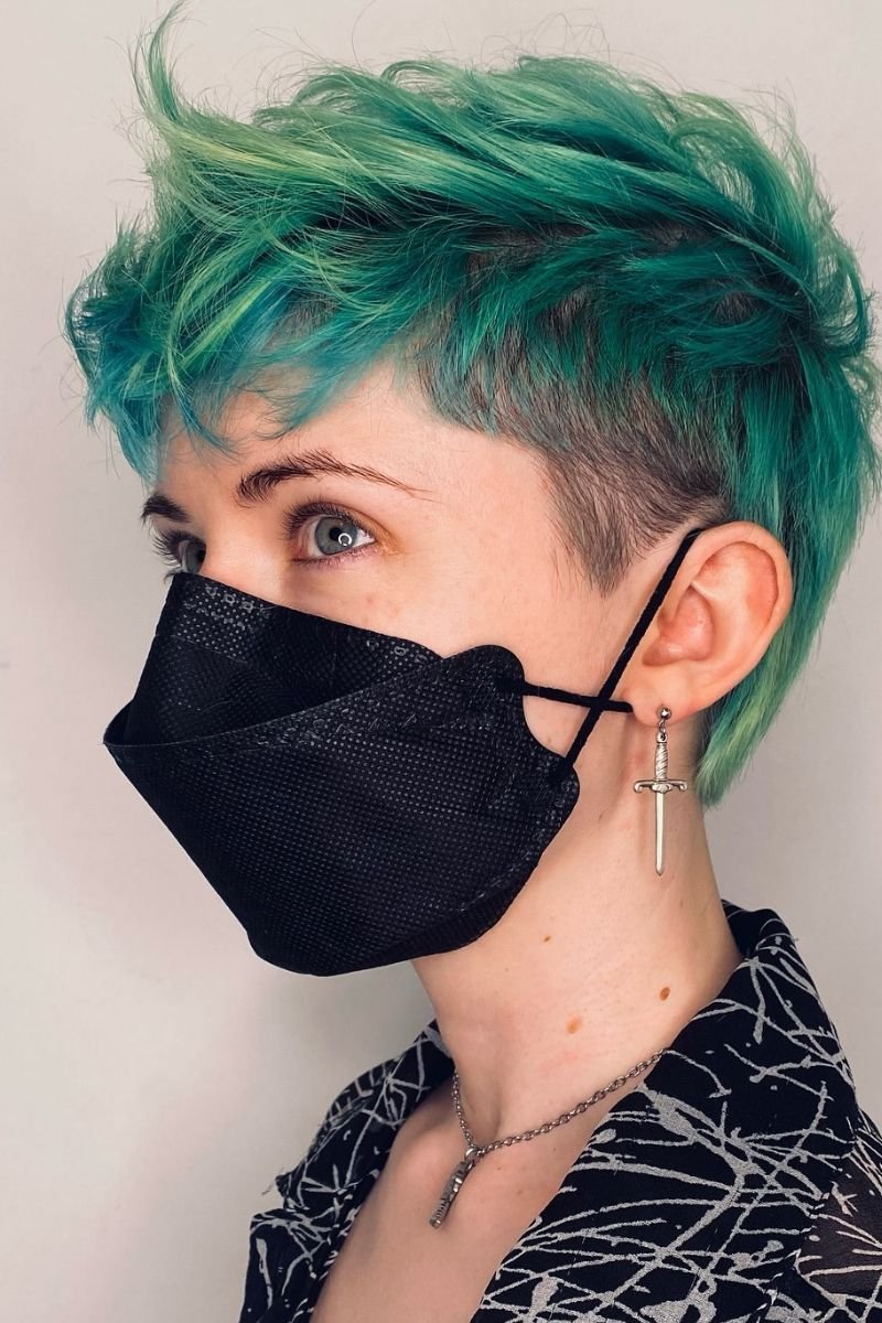 curly pixie cut with a vibrant green color