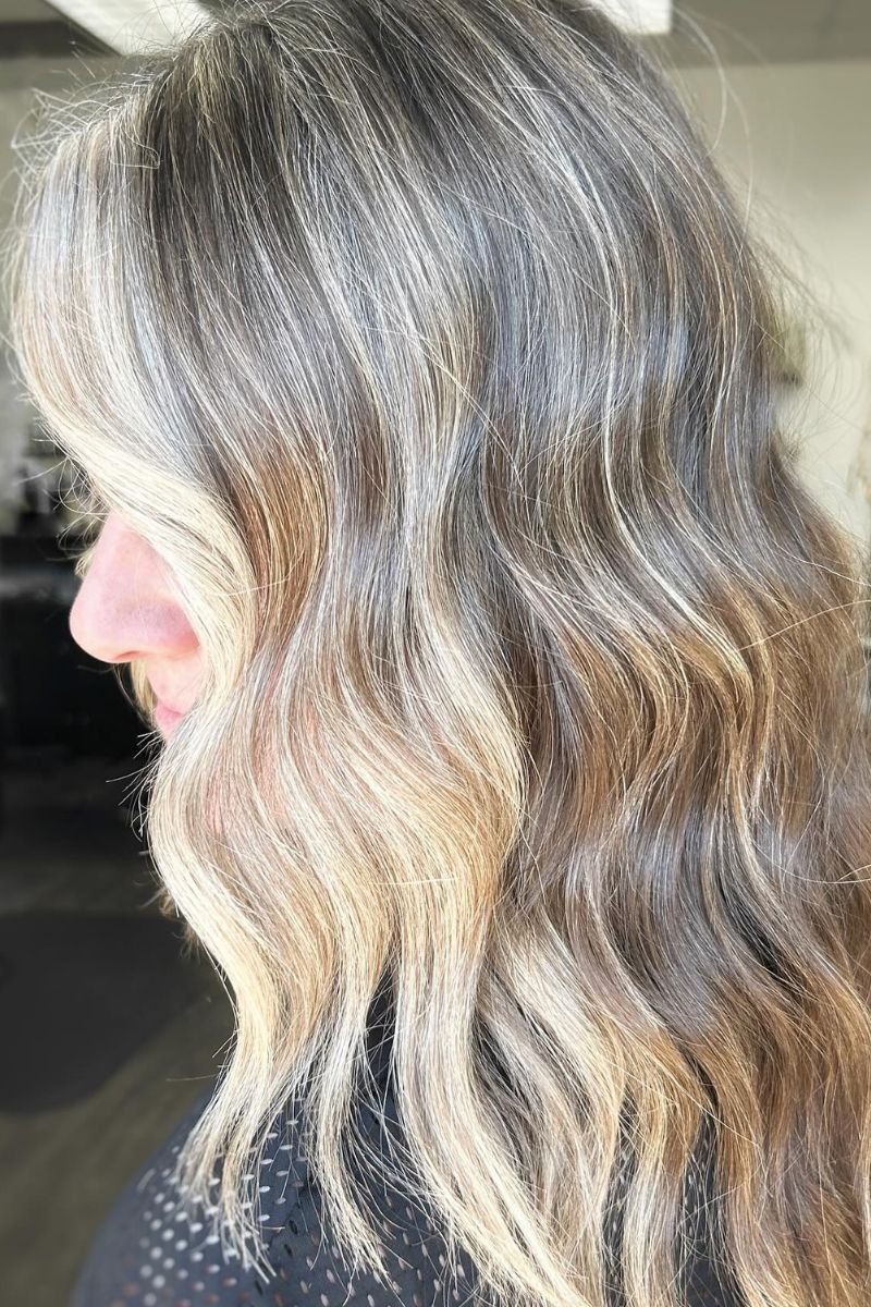 grey blending into previous balayage utilizing a classic foil highlighting technique