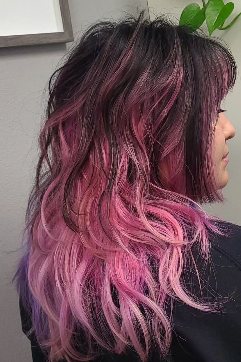 layered hair dyed in shades of pink and black