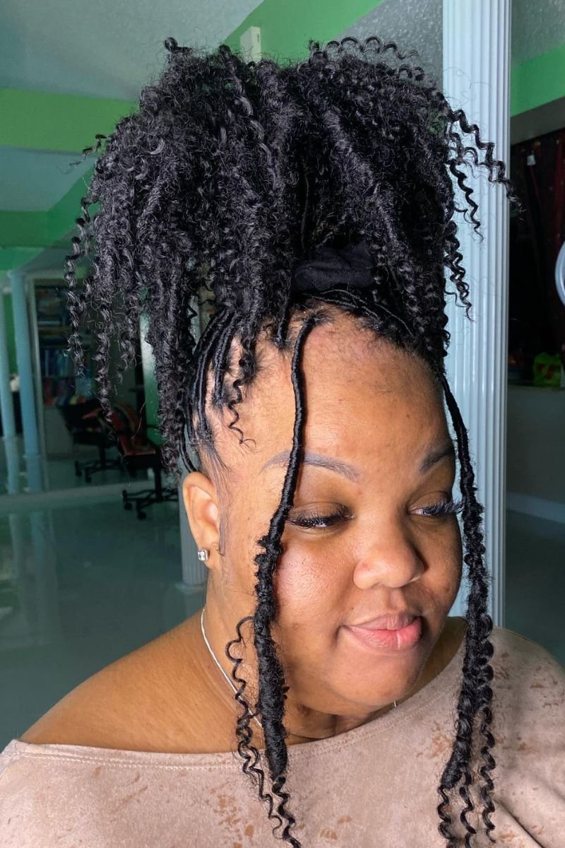 shorter crochet locs with synthetic curls at the ends