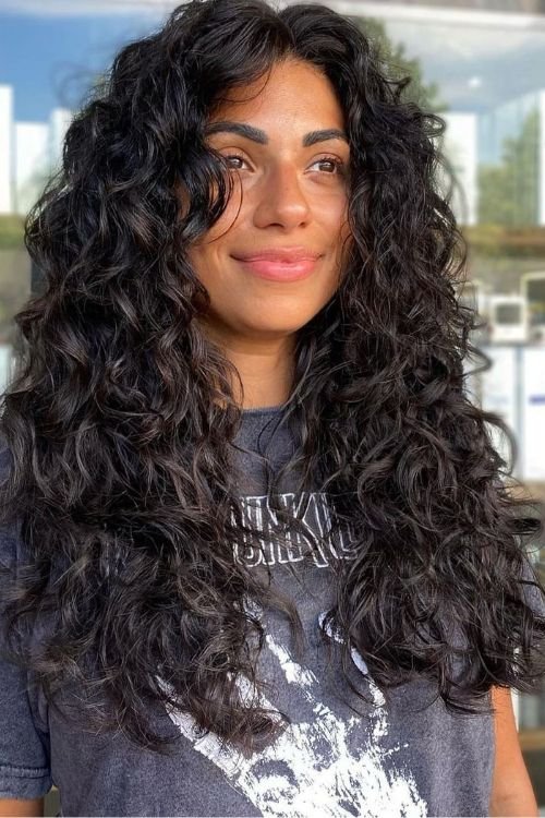 Curly wolf cut with long layers and natural volume