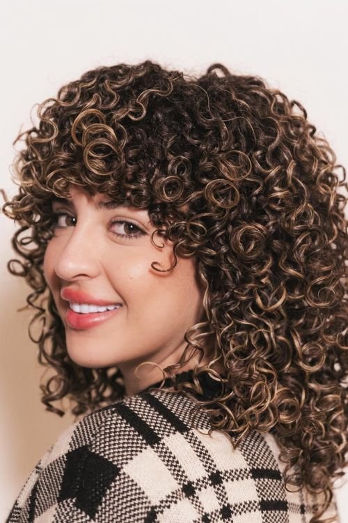 Curly wolf cut with natural curls and choppy layers