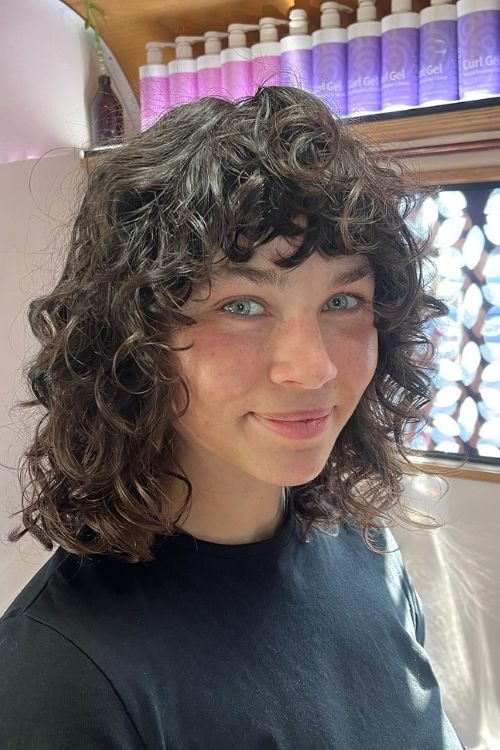 Curly wolf cut with shaggy layers soft bangs