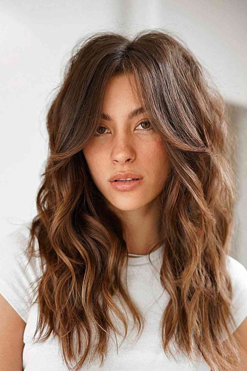 Long Layered Waves with Curtain Bangs and Subtle Highlights