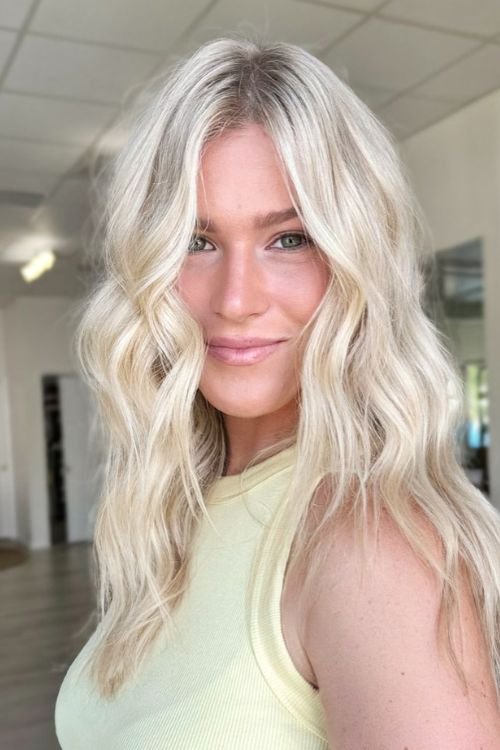 Long wavy blonde with soft middle part