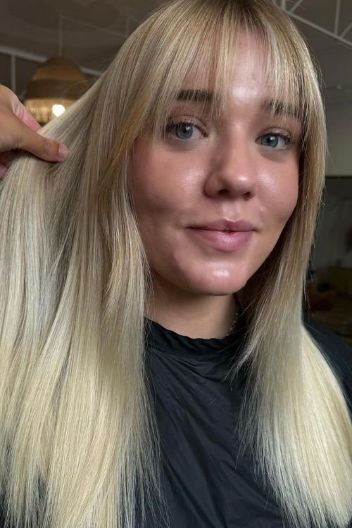 Old money blonde straight cut with blunt bangs