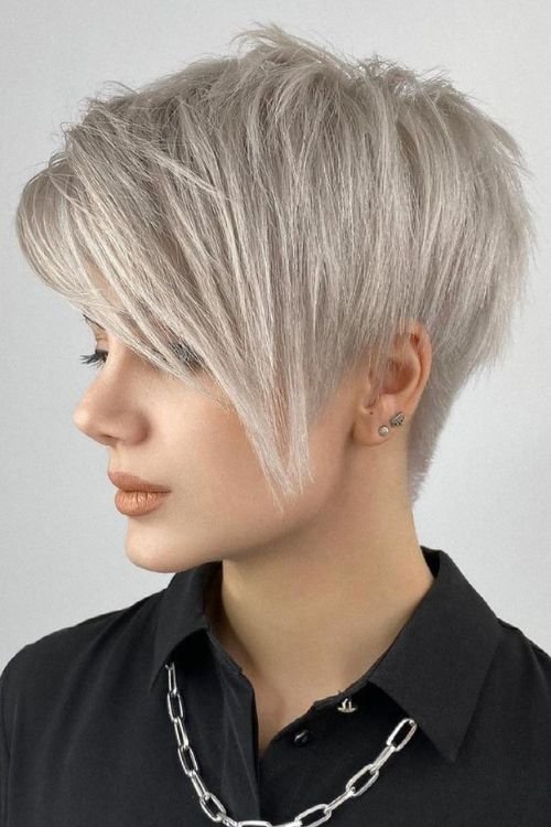 Platinum Blonde Undercut Bob with long side-swept bangs