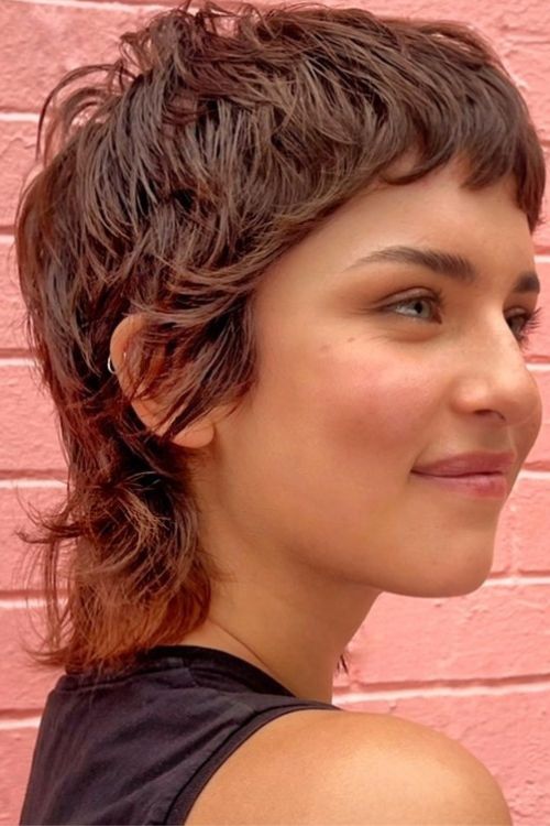 Soft mullet with choppy layers tousled texture and micro bangs