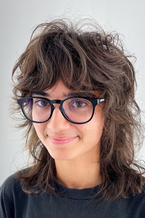 Soft mullet with shaggy layers voluminous crown and face-framing bangs
