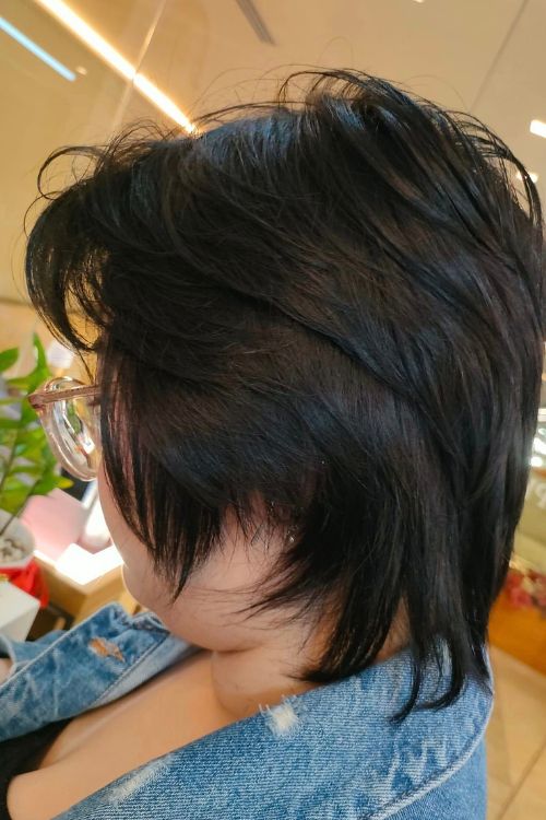 Soft mullet with short choppy layers undercut and wispy ends