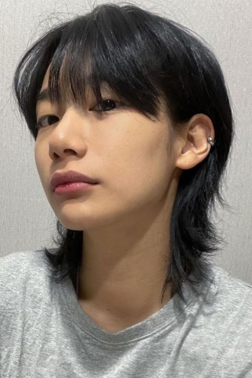 Soft mullet with straight layers wispy bangs and sleek texture