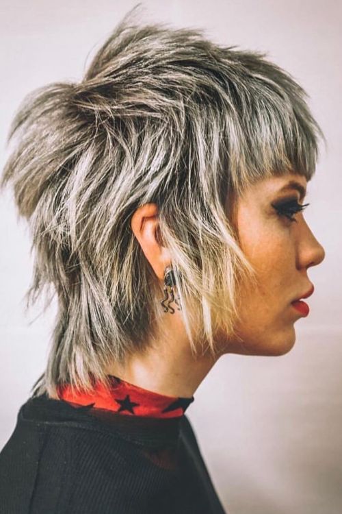 Soft mullet with textured layers choppy bangs and wispy ends