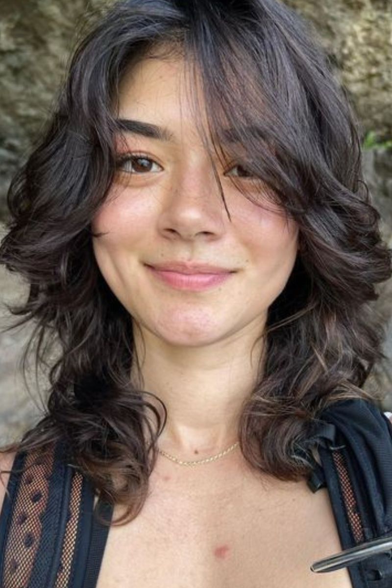 Tousled shag with curtain bangs