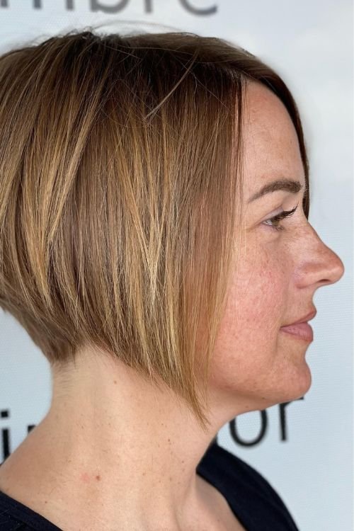 Undercut bob side-parted no bangs light brown with subtle highlights