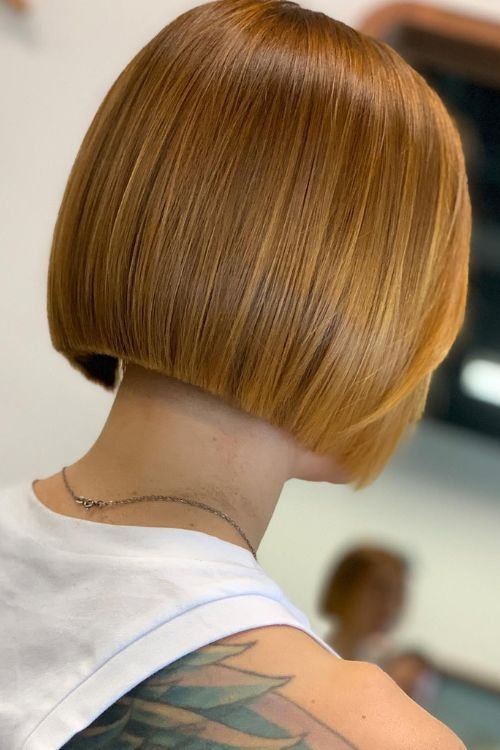 Undercut bob sleek finish no bangs warm copper color