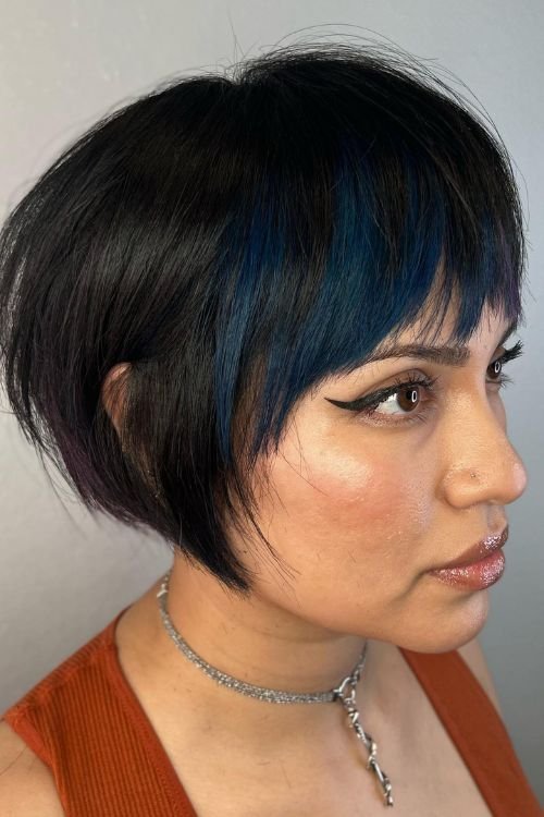 Undercut bob with straight bangs blue highlights dark base