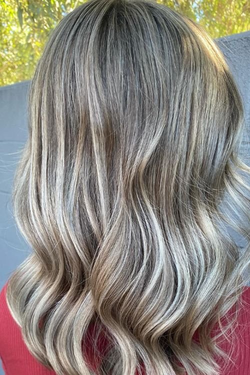 Wavy blonde balayage with soft layers