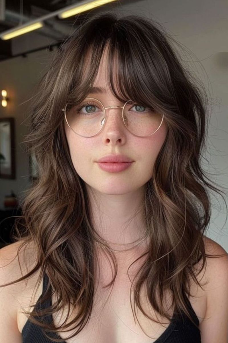 Wavy shag with soft bangs.