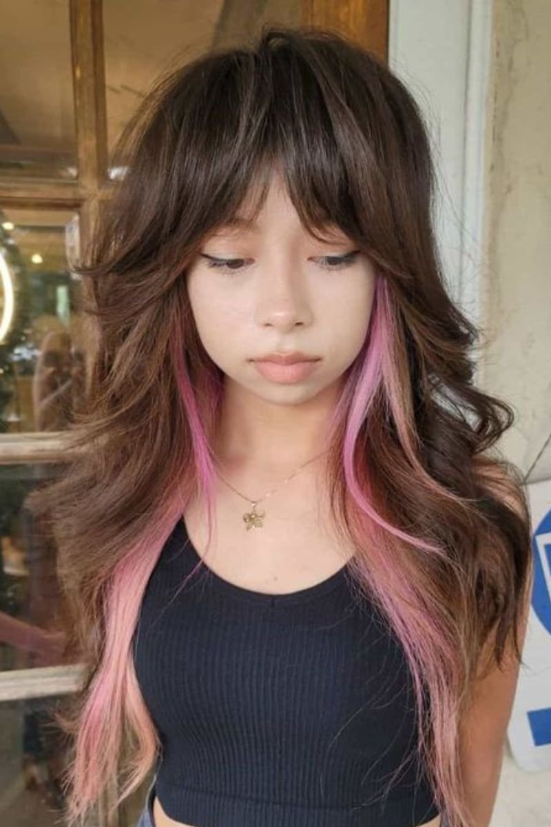 brown wolf cut with bold pink highlights