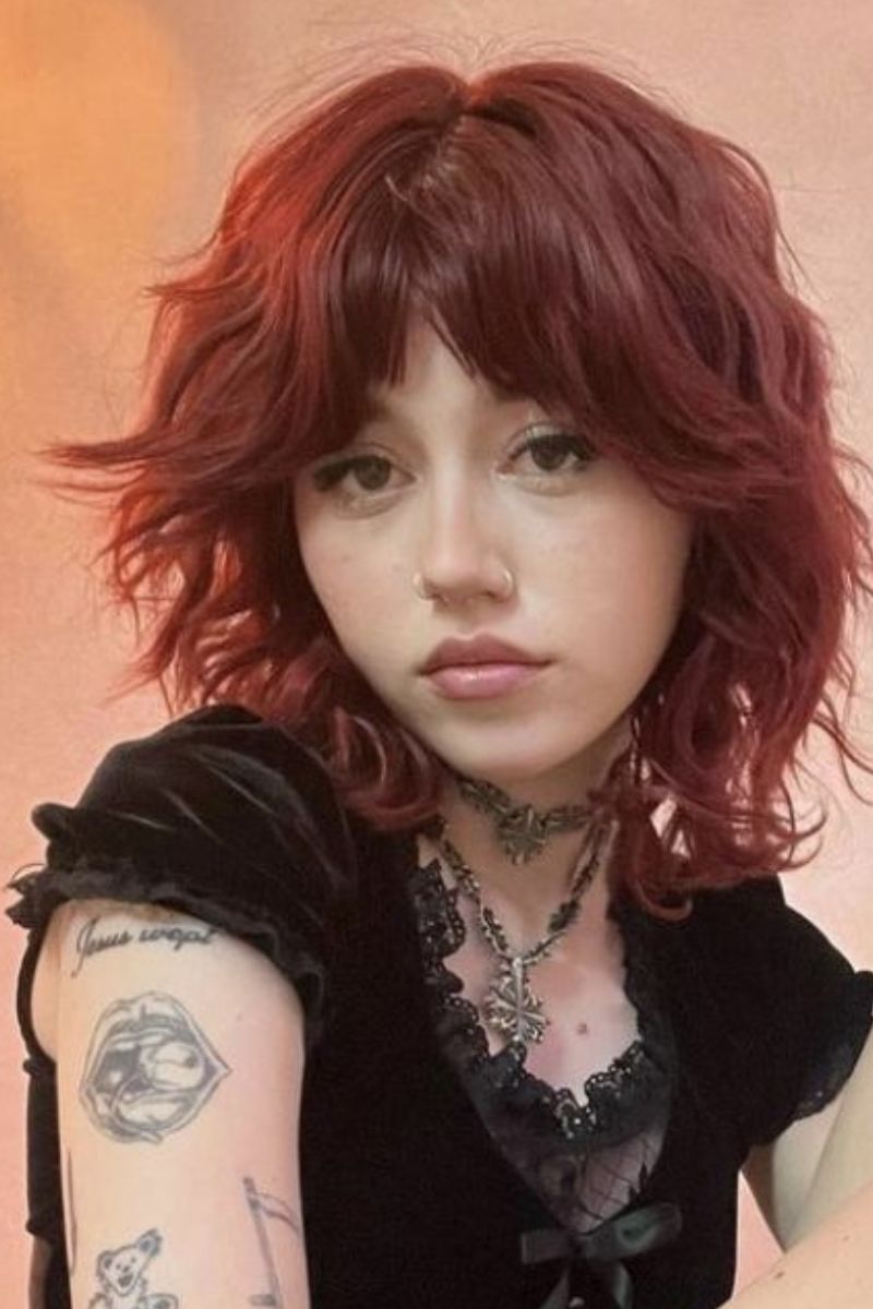 short, tousled shag cut with soft waves and piecey, face-framing bangs
