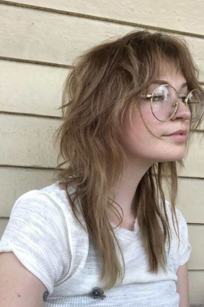 soft, bohemian shag cut with light, wispy layers and fringe bangs