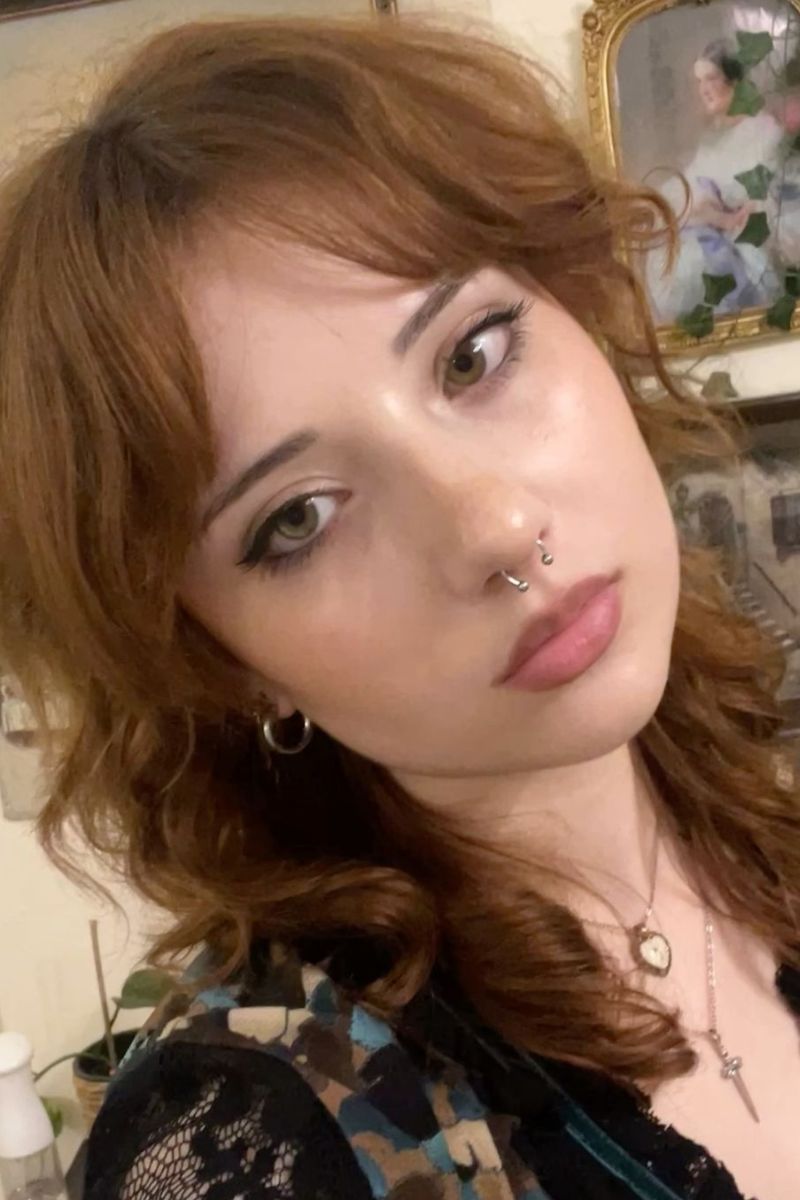 soft, vintage-inspired shag cut with loose waves and curtain bangs