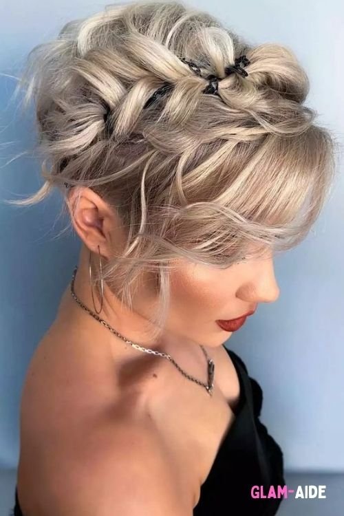 Braided crown with tousled waves and wispy bangs