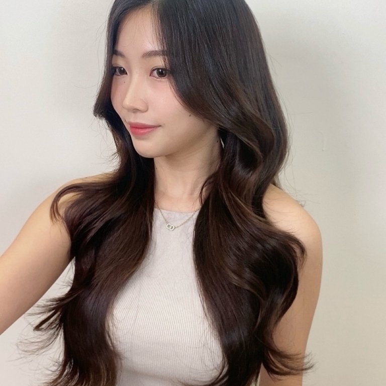 Long Layered Waves with Curtain Bangs