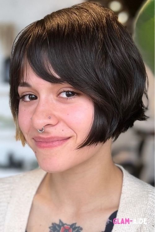 Textured razor cut bob with soft layers and wispy bangs