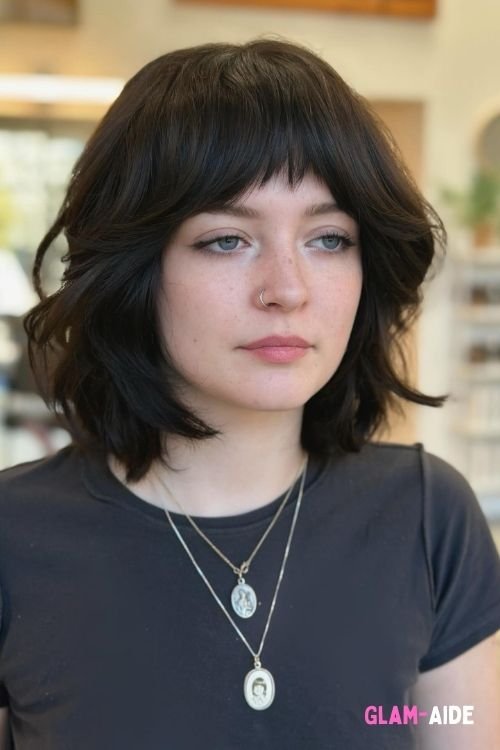 Wavy razor cut bob with textured layers and choppy bangs